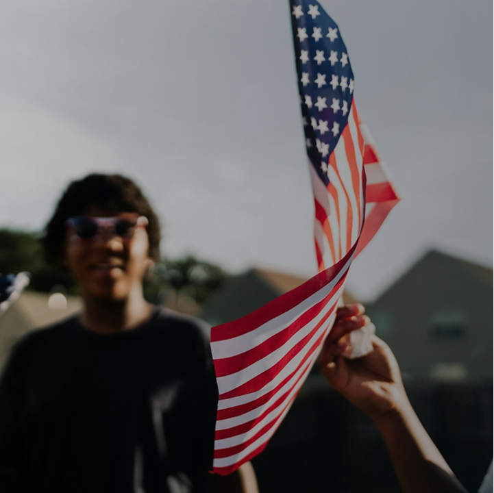 Supporter holding an American flag